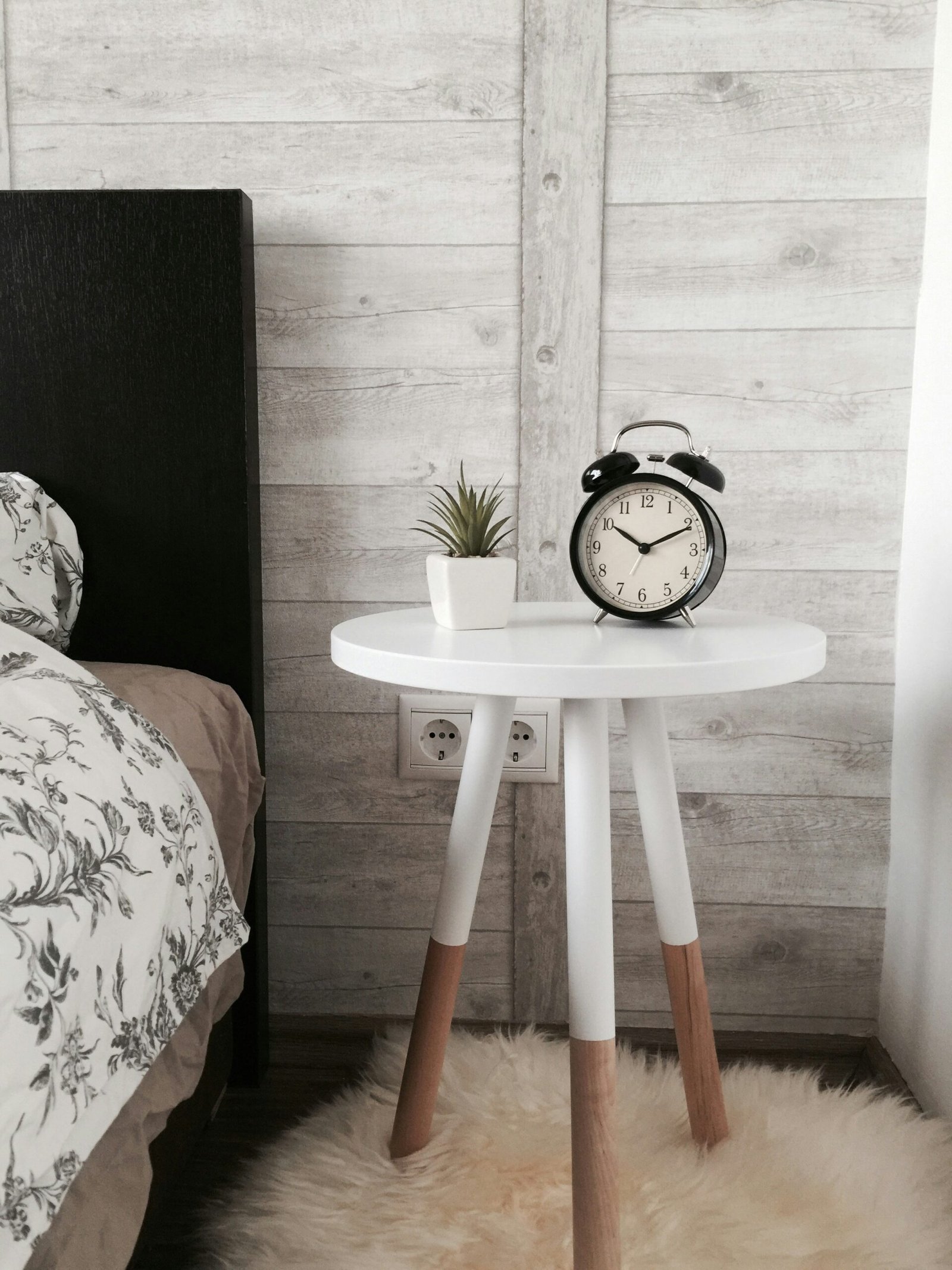 Vastu Shastra for Peaceful Sleep: Designing the Perfect Bedroom 5 black alarm clock at 10:10 on white wooden table near table