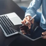 Entrepreneur starting an online business in 2025 with digital tools.
