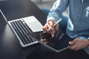 Entrepreneur starting an online business in 2025 with digital tools.